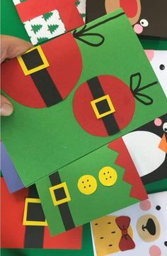 someone is making christmas cards out of construction paper