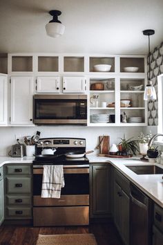 the instagram page shows an image of a kitchen with white cabinets and black appliances