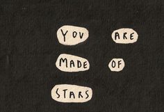 the words you are made of stars written in white on a black background with small oval shapes