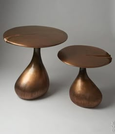 two small round tables sitting on top of each other