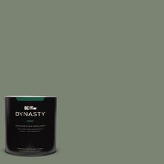 a can of paint on a green background with the words dymasty written in white