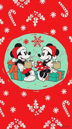 two mickey and minnie mouses sitting on presents in front of snowflakes with candy cane