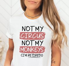 a woman wearing a t - shirt that says not my circus not my monkeys i'm retired