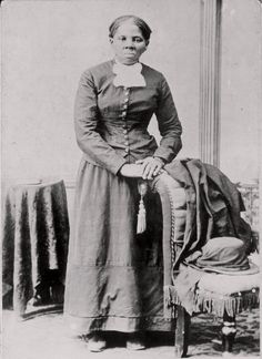 an old black and white photo of a woman