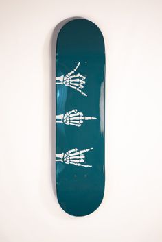 a blue skateboard with white hand prints on it