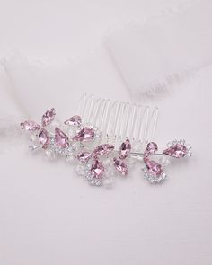 New color This perfectly sized wedding comb features sparkling high quality bicone diamond crystals with accents of pink pear and marquise rhinestones that is the perfect accessory for the bride or any special occasion event.  DETAILS * High quality crystals with pink and clear rhinestones.  * Measures 3 inches wide and 1 1/4 inches tall. * Perfect for a side or back comb accessory for the bride, mother of the bride, parties, or any special occasion. * Finish: silver, gold or rose gold. SHOP MORE JEWELRY & HAIR ACCESSORIES:  http://www.etsy.com/shop/AllureWeddingJewelry SHIPPING * Leaves our facility within 1-2 business days. * Shipping upgrades include priority mail, UPS ground, two-day and overnight delivery. Wedding Comb, Hair Comb Clips, Gold Shop, Crystal Hair Comb, Bridal Comb, Event Details, Crystal Hair, Crystal Wedding, Pink Rhinestones