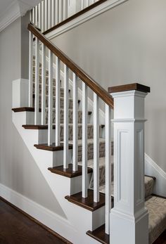 the stairs in this house are made of wood and white