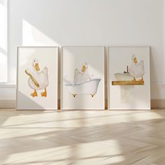 three framed pictures of ducks in a bathtub