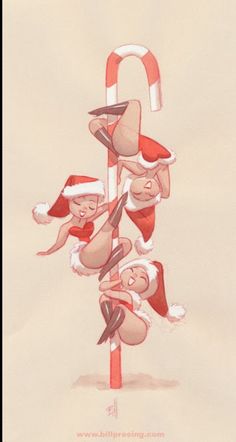 three people in santa hats hanging upside down from a pole with candy canes on it