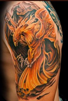 a man with a tattoo on his arm that has an orange and black dragon on it