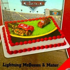 a birthday cake with cars on it and the name lightning mcqueen & matere