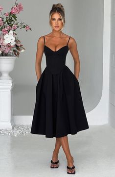 Make an entrance in Mariella, the party midi of your dreams this season. Super feminine and chic, this black dress is truly an icon with a structured, corseted bodice that's boned to cinch your waist and contrasted by a full, voluminous skirt. Holiday Party Fashion, Maxi Dress Sale, Stylish Party, Necklines For Dresses, Night Out Dress, Black Midi Dress, Stunning Dresses, Dress Collection, Fit And Flare