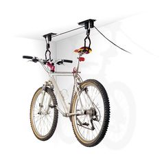 a bicycle is attached to the back of it's frame and has two wheels