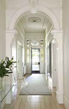 the hallway is clean and ready for us to use as an entrance way in this home