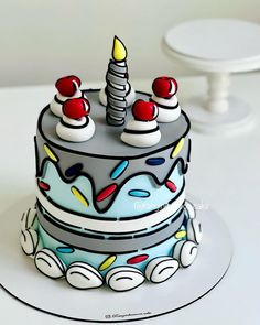 a birthday cake with candles and decorations on it