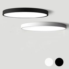 two black and white circular lights hanging from the ceiling