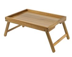 a wooden tray with two legs sitting on top of it