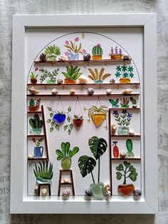 a white frame with some plants on it