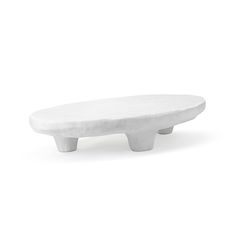 a white surfboard sitting on top of a table