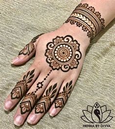 a henna tattoo is shown on someone's hand