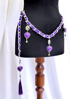 Hand Made Purple Hearts & Silk Ribbon Chain Waist Belt. This adjustable chain belt which sits right at the hip is made with big silver curb links which are interwoven with a rich purple satin ribbon on a shoe lace backing. Embellished with dangling purple resin hearts and silver disc charms, (7  Hearts and 7  Discs) Finished with a Purple heart and Long Purple Silk Tassel.   The belt is adjustable and closes with a hook depending upon the desired length of wear for the belt.  Chain waist belt to Chain Waist Belt, Resin Hearts, Jeweled Belts, Purple Resin, Purple Belt, Belt Chain, Purple Hearts, Ribbon Belt, Rich Purple