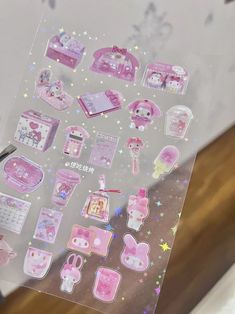 an assortment of hello kitty stickers on a table