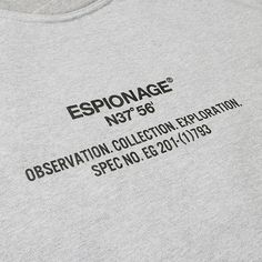 a grey t - shirt with an inscription on the chest and black writing that reads esponage no 75 observation collection explanation