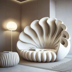 a large white shell shaped chair sitting next to a lamp