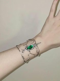 Elven bracelet made with aluminum wire and emerald green crystal. Fantasy Wire Jewelry, Elven Bracelet, Fantasy Bracelet, Fantasy Wire, Eden Garden, Emerald Green Crystal, Outfit Planning, Elven Jewelry, Forest Elf