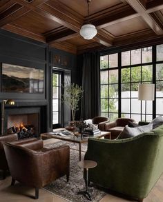 a living room filled with furniture and a fire place