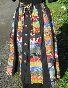 "This is a black and pieced oriental print paneled \"umbrella\" skirt. That means it folds upon itself in sections which makes for easy packing for when you travel to Hawaii or another destination.It is 100% washable and dry-able. Button up and turn inside out to reduce possible button damage. Remove from dryer immediately when finished to minimize wrinkles. The waist has a drawstring tie which can cinch in the waist if desired; maximum waist size is 31\". Back length of the skirt is also 31\". I can shorten this for you if desired." Black Patchwork Skirt, Patchwork Skirt Diy, Vintage Patchwork Skirt For Festival, Hippie Long Patchwork Skirt, Hippie Patchwork Fitted Skirt, Hippie Cotton Patchwork Skirt, Retro Cotton Patchwork Skirt, Boho Bottoms, Minimize Wrinkles