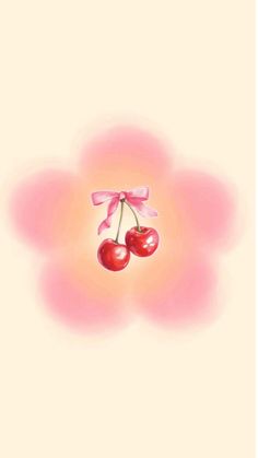 two cherries with pink bows on them are floating in the air