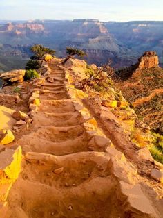 a long stone path leading to the top of a cliff in grand canyon national park