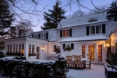 a white house covered in snow at night