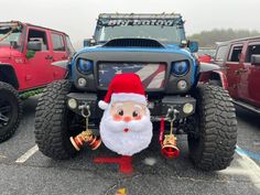 a jeep with a santa clause on the front