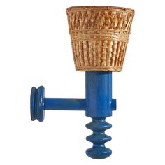 a blue pipe with a basket on it