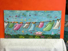 a painting of clothes hanging on a line