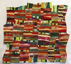 a piece of art made out of different colored fabrics