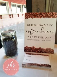 coffee beans are in the jar next to a sign