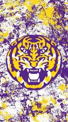 the lsu tigers logo is shown on a grungy background in purple and yellow