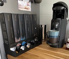 a coffee maker sitting on top of a wooden counter