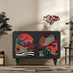 a black cabinet with colorful designs on it