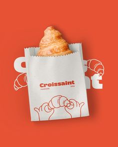 a croissant bag on an orange background