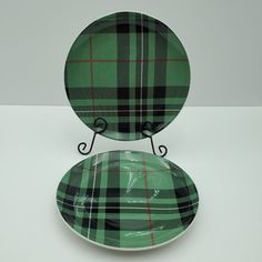 a green and black plaid plate sitting on top of a white table