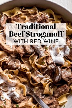 traditional beef stroganoni with red wine in a white bowl on a table