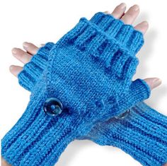 a woman's hand wearing a blue knitted mitt with buttons on it