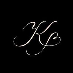 the letter k is written in cursive writing on a black background with white ink