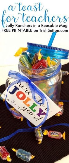 a jar filled with candy and a tag that says joy is for teachers on it