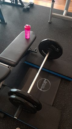 the gym equipment is clean and ready to be used by someone in the room with no shoes