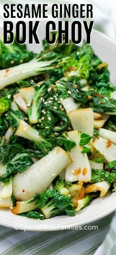 a white bowl filled with broccoli, onions and sesame ginger book choy